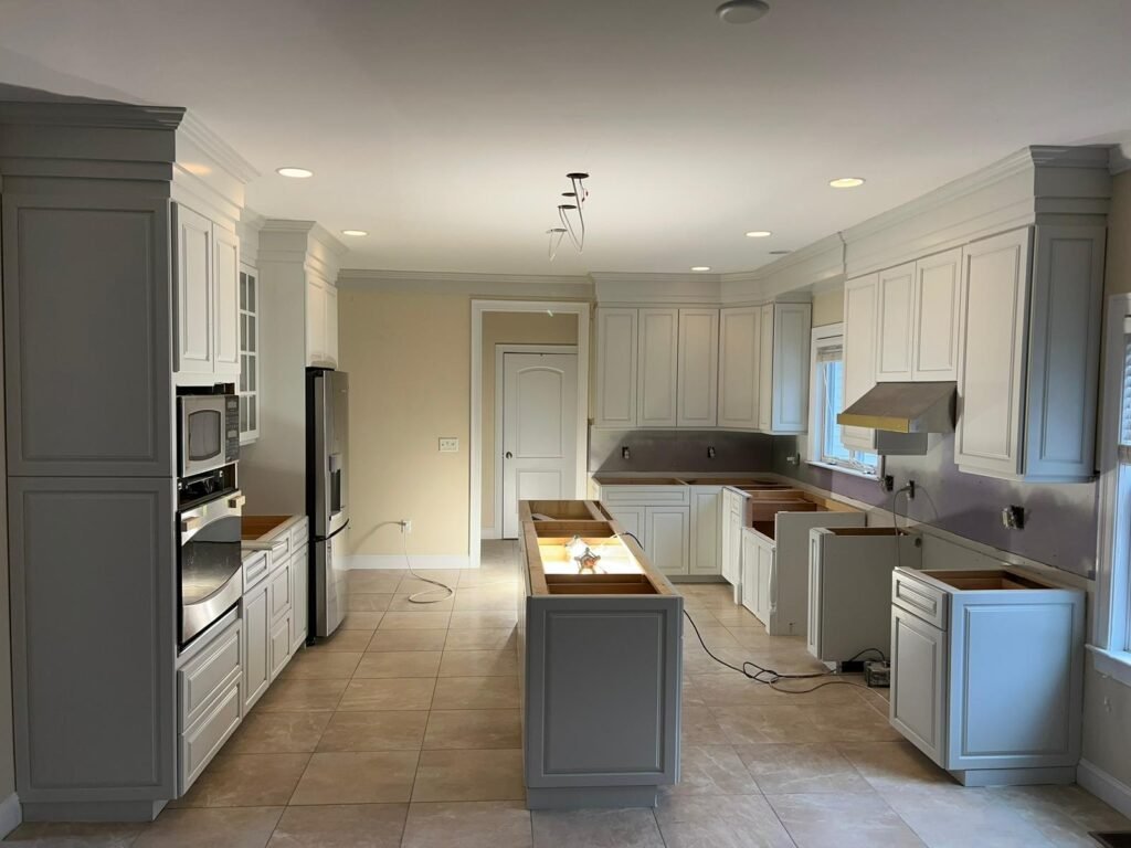 Freshly remodeled kitchen cabinets painted in a bright white finish